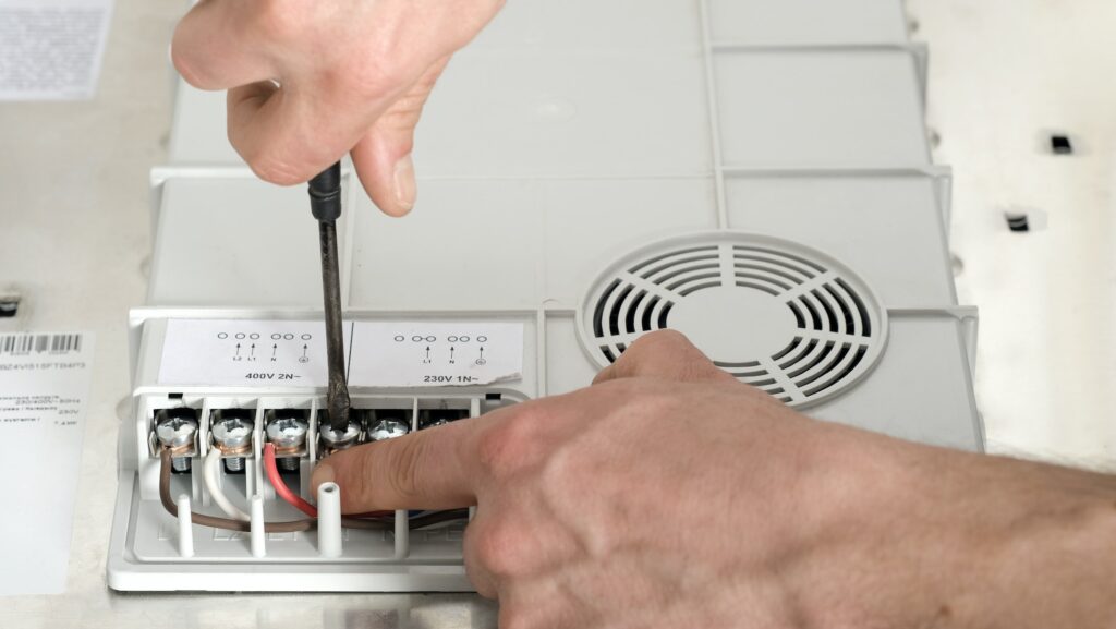 Electrical connection of the induction cooker, contacts, electricity. Electrician, handyman